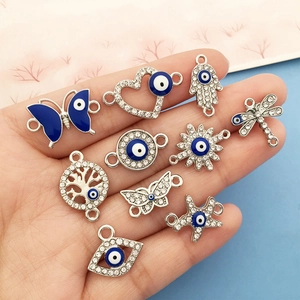 Set dettagliato di ciondoli Evil Eye in argento con farfalle e soli per gioielli fai da te