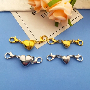 Macro view of magnetic heart-shaped lobster clasps for DIY necklaces and bracelets