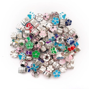 Detailed view of assorted colorful enamel DIY charms and large hole beads for bracelets