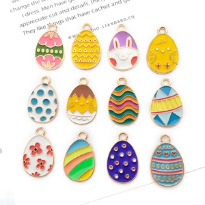 Detail of 12 colorful Easter egg charms with enamel rabbit and floral patterns for DIY jewelry