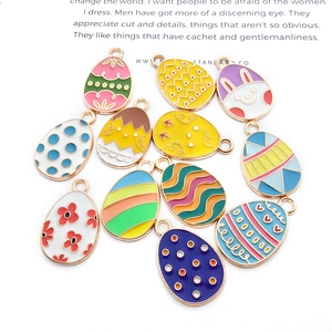 Detail of colorful Easter egg alloy charms with floral patterns and bunny designs