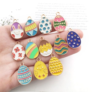 Detailed set of colorful Easter egg charms with rabbit and floral enamel patterns