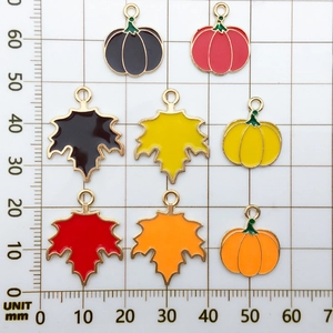 Autumn enamel maple leaf and pumpkin pendants set in assorted colors with size grid