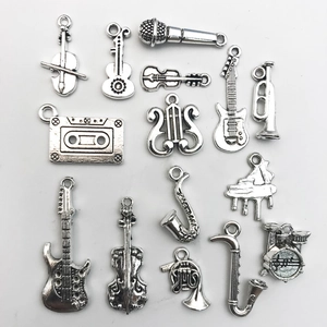 Detailed set of 14 vintage silver musical instrument pendants for DIY jewelry making