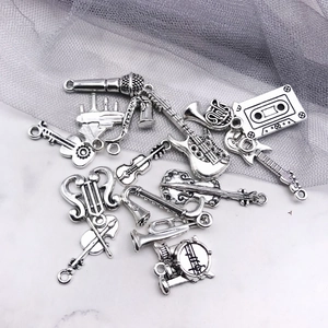 Collection of antique silver music instrument charms for DIY jewelry making