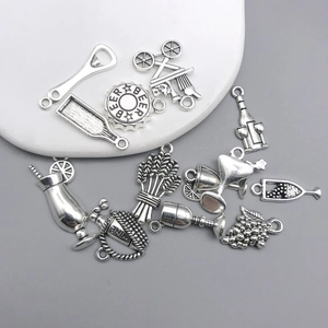 Detailed collection of vintage silver wine and beer charms with grape and bottle motifs