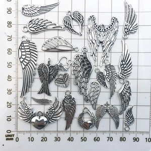 Vintage silver alloy angel wing charms in various sizes and styles for jewelry making