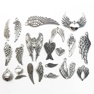 Detailed collection of antique silver wing pendants in various designs for DIY jewelry making