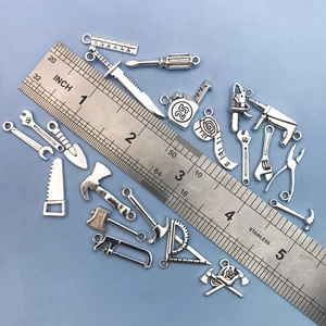 Zinc alloy DIY hardware tool pendant set with wrench and hammer on blue background