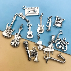 Vintage silver instrument charms for DIY jewelry featuring guitars, violins and pianos
