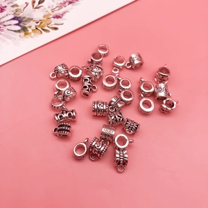 Macro shot of antique silver alloy beads and connectors for DIY jewelry making crafts