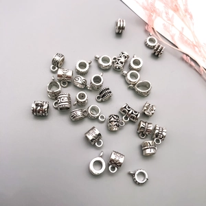 Detailed collection of vintage silver alloy charms and connectors for DIY jewelry making
