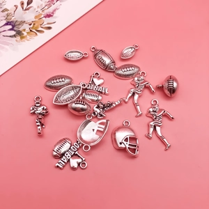 Detailed set of silver alloy football charms for DIY jewelry making and necklaces