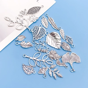 Detailed set of antique silver leaf charms and botanical pendants for DIY jewelry making