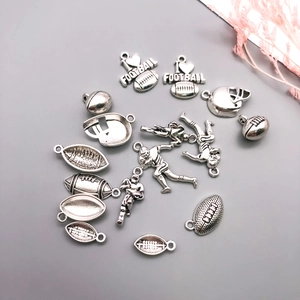 Antique silver American football pendants including helmet and heart-shaped football charms