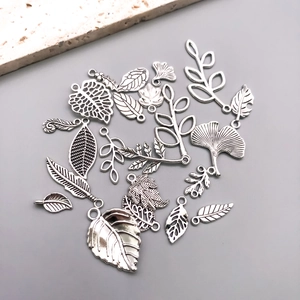 Detailed view of Tibetan silver hollow leaf pendants with intricate vein textures for DIY