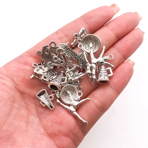 Antique silver cheerleader alloy charms set featuring megaphones and jumping athletes