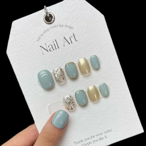 Short square press-on nail kit in blue, champagne gold, and silver glitter finish