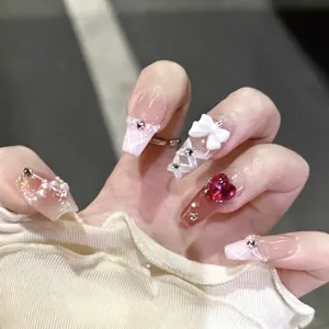 Handmade ballerina press-on nails with 3D bows, rubies, and pink plaid patterns