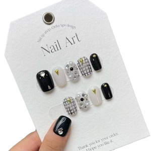 Handmade press-on nails with tweed pattern, pearls and rhinestones on white display card