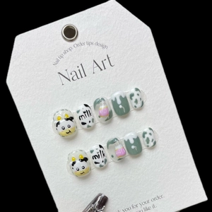 Handmade cow themed press-on nails set featuring 3D cartoon art and sage green finish