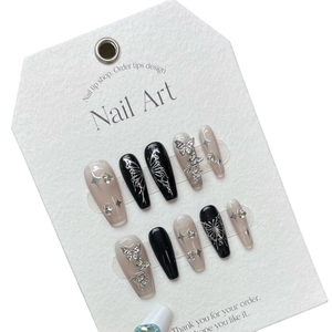 Handmade Y2K coffin press-on nails with silver 3D butterflies and starry black design