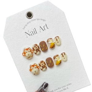 Handmade 3D cartoon monkey press-on nail set with caramel colors and banana art