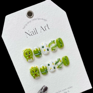 Handmade green and white press-on nails with 3D snake design and cute cartoon patterns