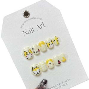 Handmade press-on nails featuring cute yellow corgi dog hand-painted cartoon designs