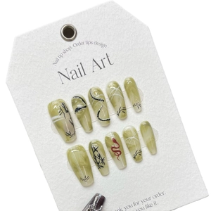 Artistic green marble press-on nails with black and red snake patterns in long coffin shape