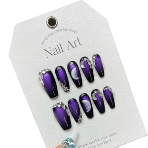 Handmade purple galaxy press-on nails with cat eye effect and celestial moon designs