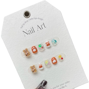 Handmade press-on nails for girls featuring 3D brown bears and cute glitter star designs