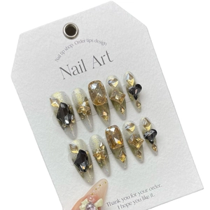Luxurious handmade press-on nails with green gradient and gold glitter with 3D gems