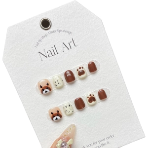Kids press-on nails set with brown bear designs and 3D bow accents for girls