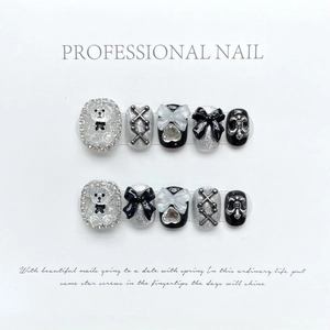 Handmade Y2K press-on nails with black bows, glitter hearts, and 3D bear charms