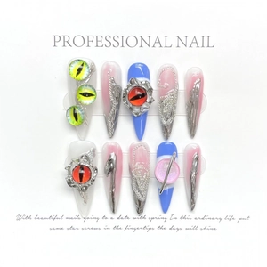 Gothic stiletto press-on nails featuring 3D demon eye and silver metallic chain details