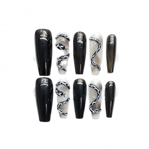 Handmade press-on nails with 3D black snake pattern and glossy monochrome finish