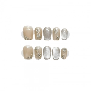 Handmade cat-eye press-on nails with 3D floral designs and champagne gold glitter accents