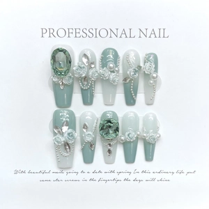 Handmade gradient press-on nails with green crystals, white roses, and pearls