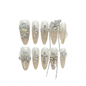 Handmade stiletto press-on nails with jelly gradient, gold foil, and silver chain charms