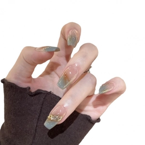 Blue and nude gradient press-on nails with golden embossed relief and foil decoration