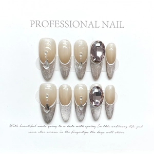 Sparkly cat-eye press-on nails with purple gemstones and silver glitter almond tips