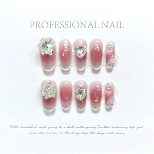 Handmade pink gradient cat eye press-on nails with 3D star charms and heart accents
