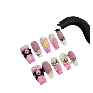 Handmade 10-piece press-on nails in pink gradient with 3D monster eyes and crosses