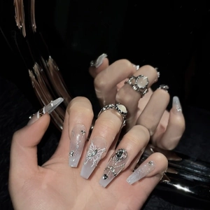 Gradient butterfly press-on nails with silver charms and rhinestones on black fur base