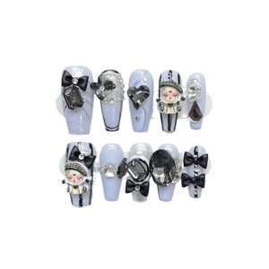 Handmade long trapezoid press-on nails with 3D black bows and cartoon girl figure charms