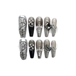 Handmade gothic Y2K press-on nails with metallic silver gradient and 3D metal charms