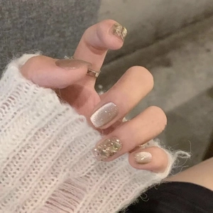 Sparkling milk tea cat-eye press-on nails with champagne gold glitter and foil accents