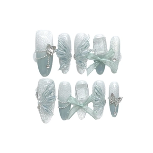 Blue glitter cat eye press-on nails with 3D butterflies and sculpted wings