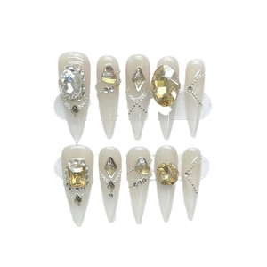 Champagne gold stiletto press-on nails with sparkling crystals and silver micro-bead fringe